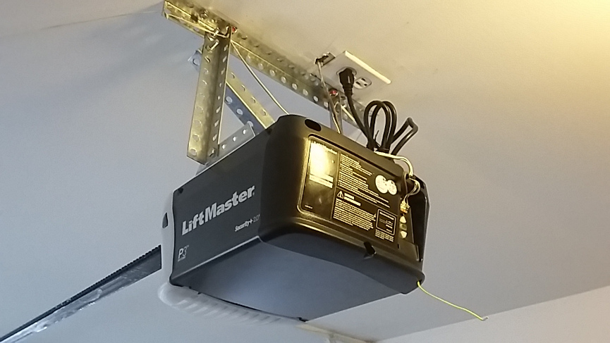 New LiftMaster Model 8165 Chain Drive Opener Hanging from Ceiling