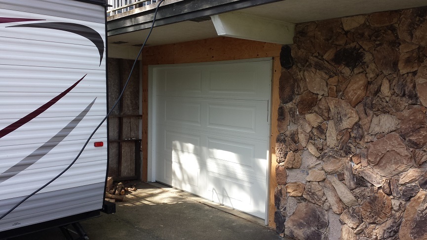 View of new garage door installed with a white finish
