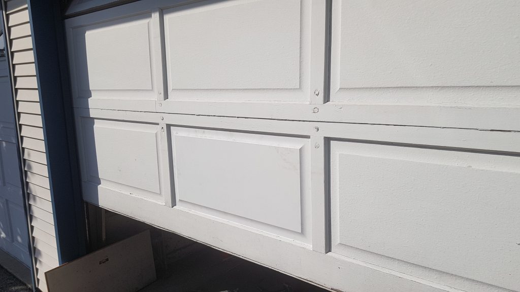 Repaired and Replaced Panel on Garage Door Section