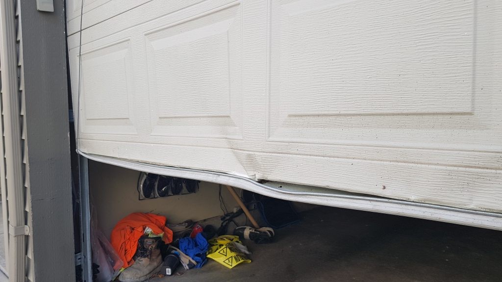 Non insulated steel door with door section damage 