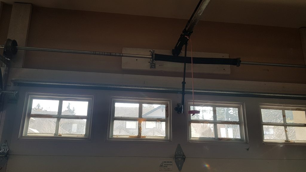 Spring Replacement on a Insulated Steel garage door with windows