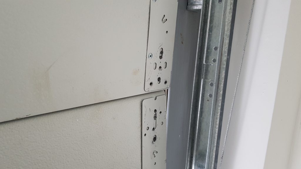 north vancouver garage door with rivets that have been added for extra strength 