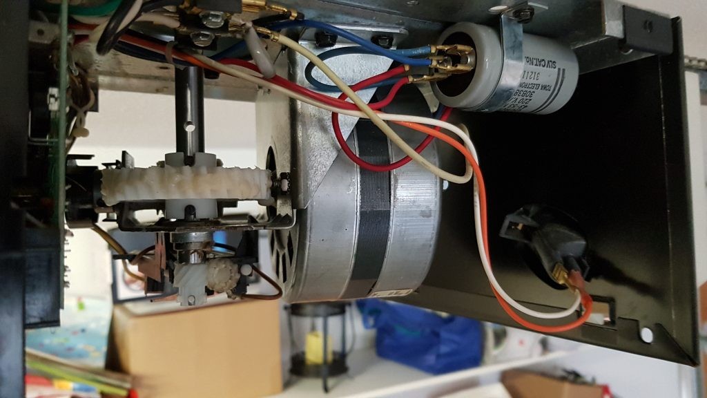 view of new gear that has been installed in a older garage door motor.