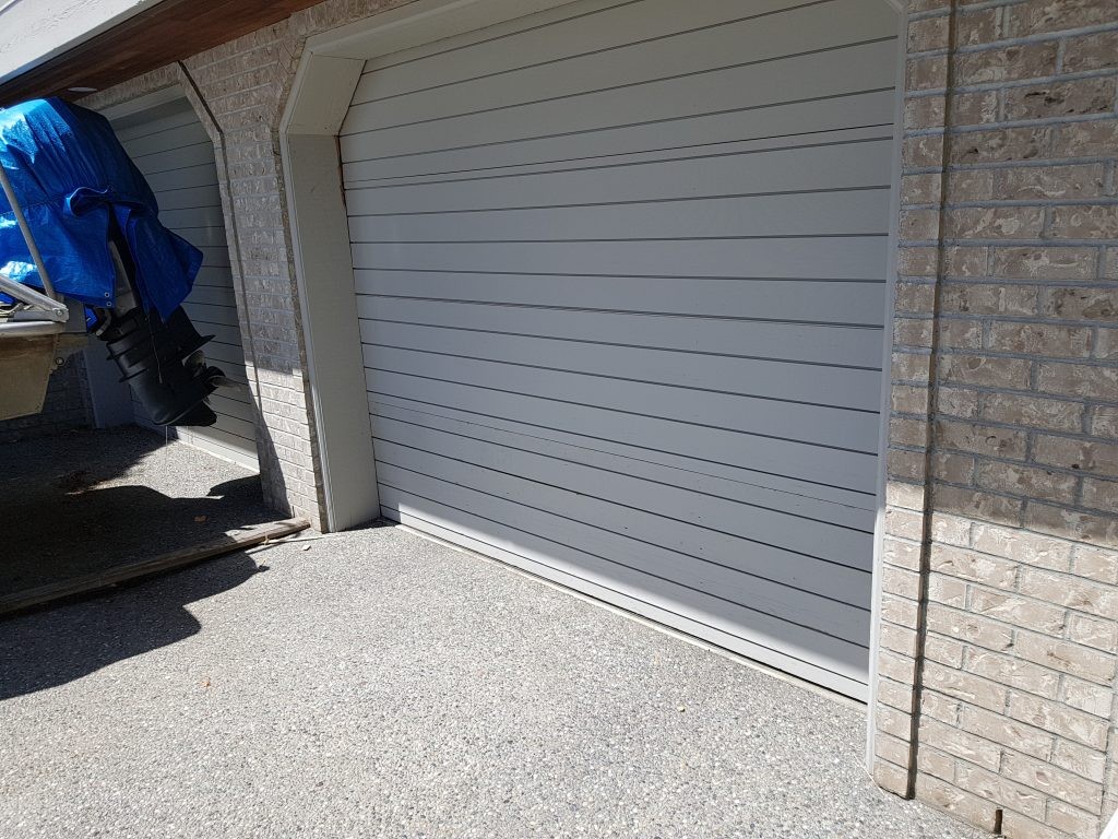 View of completed garage door with new bottom section.
