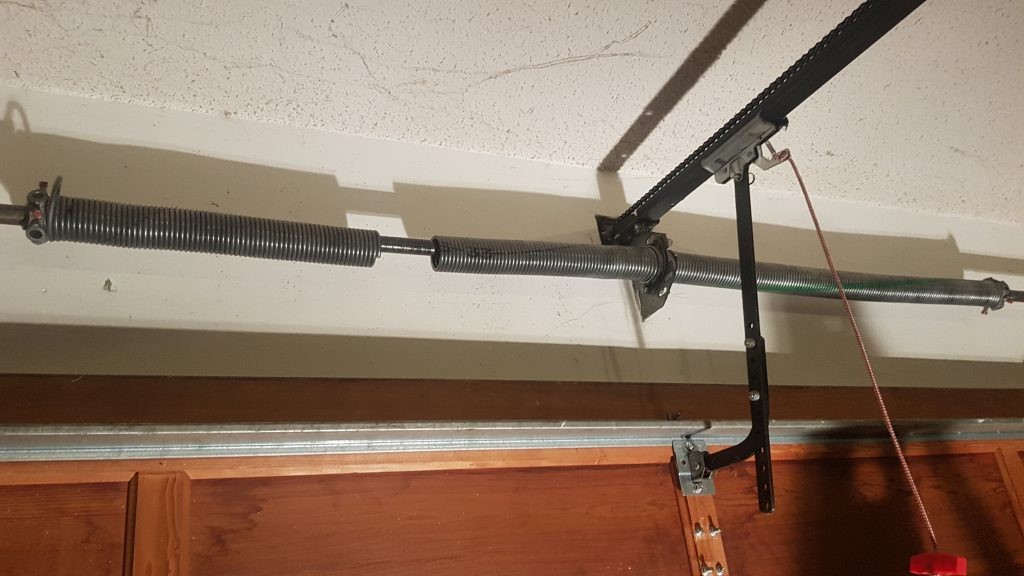 View of double spring change that is required on a 16x8 wooden garage door in Surrey
