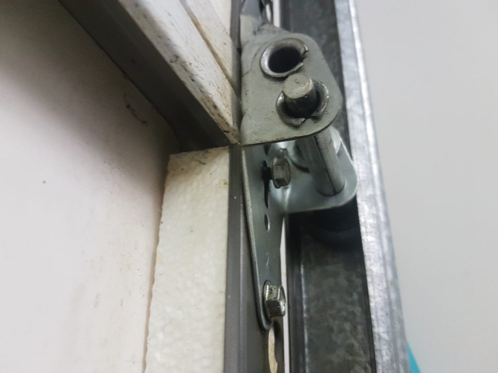 View of a loose fastener on Wayne Dalton garage door in Delta.