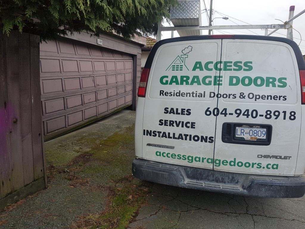 View of garage door with rollers off the track in Vancouver.